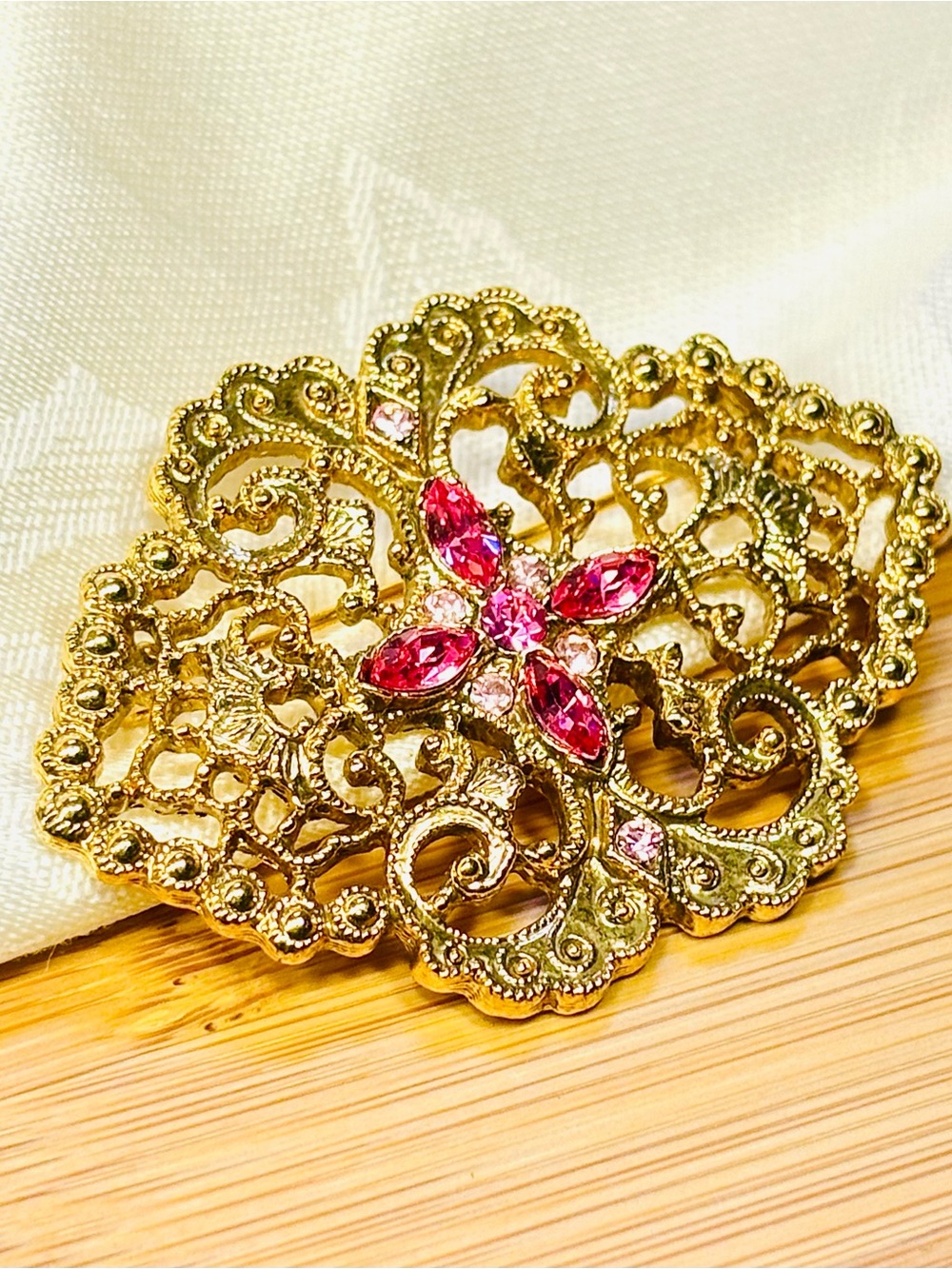 Vintage 1928 Gold Filigree Brooch with Pink Gem Accents
